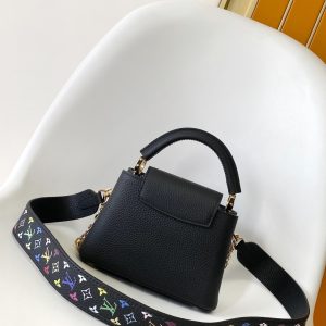 Alternative view of p1250•Taurillon cowhide leather•Cowhide leather trim•Cowhide leather lining•Metal hardware•Flap can be positioned inside or outside•Internal divider•Zippered inner pocket•Inner slip pocket•Key pouch•Padlock•Metal studs